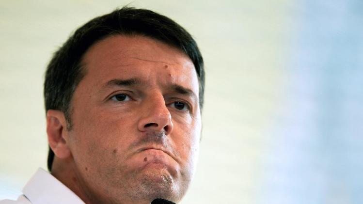 Italian Prime Minister Matteo Renzi grimaces as he addresses the Festa dell&#39;Unita, the annual Democratic Party (PD) meeting, in Bologna on September 7, 2014