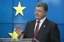 Ukrainian President Petro Poroshenko speaks during a media conference after a signing ceremony at an EU summit in Brussels on Friday, June 27, 2014. The Ukrainian President Petro Poroshenko has signed up to a trade and economic pact with the European Union, saying it may be the "most important day" for his country since it became independent from the Soviet Union. (AP Photo/Michel Euler)