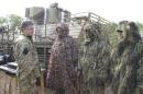 Ukraine's President Poroshenko talks to servicemen at the military camp near the town of Svyatogorsk