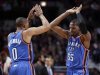 Thunder point guard Westbrook and Durant celebrates after a made basket against the Chicago Bulls during the first second of their NBA basketball game in Chicago