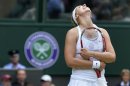 Sabine Lisicki of Germany reacts during her women's singles tennis match against Serena Williams of the U.S. at the Wimbledon Tennis Championships, in London