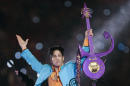 FILE - In this Feb. 4, 2007 file photo, Prince performs during halftime of the Super Bowl XLI football game in Miami. A posthumous honorary degree from the University of Minnesota is in the works for music legend Prince. The university's regents are set to vote Friday, June 10, 2016, on bestowing an honorary degree from the College of Liberal Arts to Prince Rogers Nelson, who made his home in Minnesota. (AP Photo/Chris O'Meara, File)