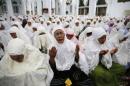 Acehnese women attend a mass prayer for the 2004 tsunami victims at Baiturrahman Grand Mosque in Banda Aceh