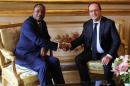 French President Francois Hollande shakes hands with Niger President Mahamadou Issoufou during a meeting at teh Elysee Palace in Paris