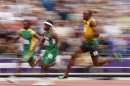 Jamaica's Usain Bolt competes in a men's 200-meter heat during the athletics in the Olympic Stadium at the 2012 Summer Olympics, London, Tuesday, Aug. 7, 2012. (AP Photo/Matt Dunham)