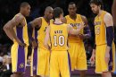 Lakers starters chat during their NBA basketball game in Los Angeles