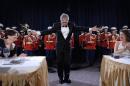 U.S. President Bush takes a bow after conducting the Marine Band at the annual White House Correspondents Association dinner in Washington