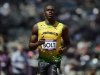 Jamaica's Usain Bolt finishes first in his men's 100m round 1 heats at the London 2012 Olympic Games at the Olympic Stadium