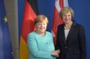 German Chancellor Merkel and British Prime Minister May shake hands after news conference in Berlin