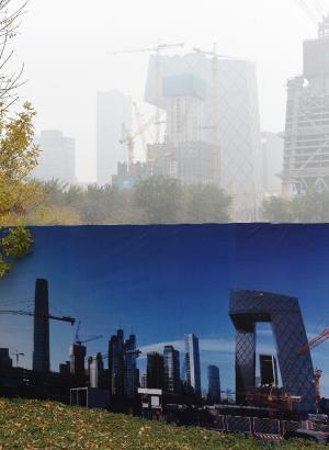 A billboard photo showing the Beijing skyline on a …