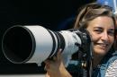 AP photographer Anja Niedringhaus laughs as she attends a swimming event at the 2004 Olympic Games in Athens