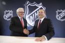 NHL Commissioner Gary Bettman, right, and Bill Foley pose for photographers during a news conference Wednesday, June 22, 2016, in Las Vegas. Bettman announced an expansion franchise to Las Vegas after the league's board of governors met in Las Vegas. Foley is the majority owner of the team. (AP Photo/John Locher)