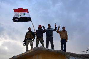 Iraqi government forces and allied militias wave as &hellip;