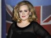 FILE - In this Feb. 21, 2012 file photo, performer Adele arrives for the Brit Awards 2012 at the O2 Arena in London.  The 24-year-old British songstress' album “21” has sold more than 10 million copies, according to Nielsen SoundScan. The album reached the milestone the week of Nov. 19, 2012, less than two years after its release.  (AP Photo/Jonathan Short, File)
