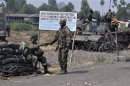 Congolese government army soldiers are seen at a checkpoint in Kanyarustshinya, outside Goma