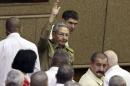 Cuba's president Raul Castro waves to the crowd during a ceremony in Havana