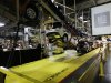 In this Monday, Jan. 28, 2013 file photo, cars move along an assembly line at the General Motors Fairfax plant in Kansas City, Kan. General Motors releases its fourth quarter of 2012 financial earnings, Thursday, Feb. 14, 2013. (AP Photo/Orlin Wagner, File)