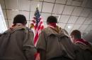Boy Scouts stand on stage with a U.S. flag during the Pledge of Allegiance to begin the inaugural Freedom Summit meeting for conservative speakers in Manchester