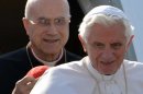 Pope Benedict XVI (front) has declared his "personal confidence" in Cardinal Tarcisio Bertone
