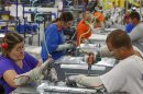 Workers assemble built-in appliances at the Whirlpool manufacturing plant in Cleveland