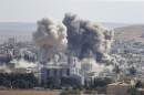 Smoke rises after an US-led air strike in the syrian town of Kobani