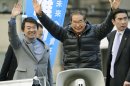 In this Dec. 9, 2012 photo, Japan Restoration Party leaders, Shintaro Ishihara, center, and Toru Hashimoto, left, wave at their party supporters during their parliamentary elections campaign in Tokyo. The buzz over Japan's parliamentary elections this Sunday, Dec. 16, has been all about 