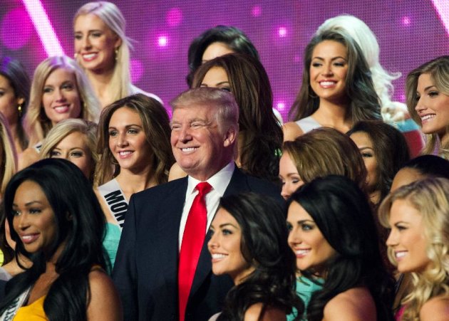 In this photo provided by the Miss Universe Organization, Donald Trump, co-owner of the Miss Universe Organization, poses for a photo with the competitors during rehearsal for the upcoming Miss USA Competition at PH Live in Las Vegas on Saturday, June 15, 2013. (AP Photo/Miss Universe Organization)