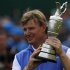 Ernie Els of South Africa holds up the Claret Jug after winning the British Open golf championship at Royal Lytham & St Annes