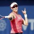 Stosur of Australia hits a return to Vinci of Italy during their women's singles quarter-final match at the WTA Dubai Tennis Championships