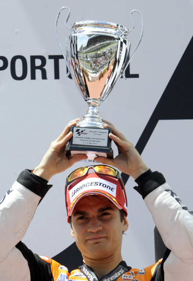 Repsol Honda team&#39;s Spanish Dani Pedrosa celebrates in the podium at the end of the Moto GP race of the Portuguese Grand Prix in Estoril, outskirts of Lisbon, on May 6, 2012.  Repsol Honda Team&#3