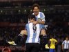 Argentina's Messi celebrates with teammate Higuain after he scored a goal against Ecuador during a World Cup qualifying soccer match in Buenos Aires