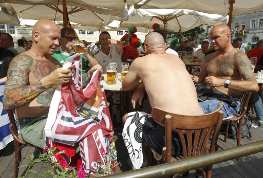 German fans drink beer in central Lviv