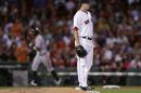Boston Red Sox starting pitcher Drew Pomeranz stands on the mound as Baltimore Orioles' Nolan Reimold rounds third on his two run, home run in the second inning of a baseball game at Fenway Park, Tuesday, Sept. 13, 2016, in Boston. (AP Photo/Charles Krupa)