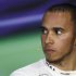 Third-placed Mercedes Formula One driver Lewis Hamilton of Britain attends a post race news conference after the Malaysian F1 Grand Prix at Sepang International Circuit outside Kuala Lumpur