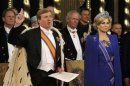 Dutch King Willem-Alexander takes the oath next to his wife Queen Maxima during a religious ceremony at the Nieuwe Kerk church in Amsterdam