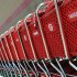 In this July 28, 2012 photo, shopping carts sit parked outside a Target store in Marlborough, Mass. Target is reporting that net income for the second quarter was unchanged, as the retailer gets ready for its upcoming move into Canada. But the retailer saw solid spending in the quarter and in a sign of confidence, the cheap chic discounter raised its earnings outlook. Target posted earnings Wednesday, Aug. 15, 2012 of $704 million, or $1.06 per share in the period ended July 30. That compares with $704 million or $1.03 per share, in the year ago period.  (AP Photo/Bill Sikes)