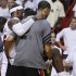 Miami Heat small forward LeBron James (6) is carried from the floor after taking a spill against the Oklahoma City Thunder during the second half at Game 4 of the NBA Finals basketball series, Tuesday, June 19, 2012, in Miami.  (AP Photo/Lynne Sladky)