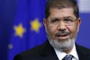 Egypt's President Mohamed Mursi answers reporters' questions after meeting European Commission President Jose Manuel Barroso in Brussels