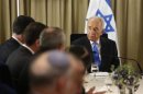 Israel's President Shimon Peres sits next to representatives of Israeli Prime Minister Benjamin Netanyahu's Likud-Beitenu party in Jerusalem