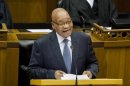 South African President Jacob Zuma laughs as he delivers his State of the Nation Address after the formal opening of Parliament in Cape Town