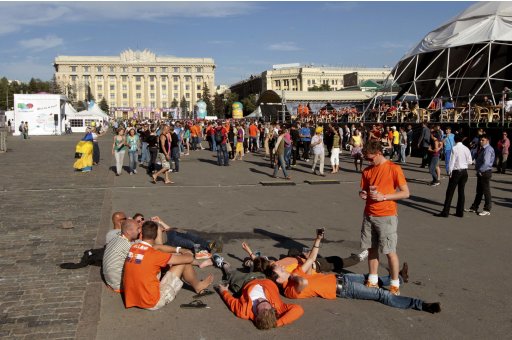 Netherlands' team fans relax as they party at the Euro 2012 fan zone in Kharkiv