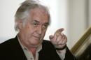 FILE - In this Tuesday, April 11, 2006 file photo, Swedish crime writer Henning Mankell gestures during a photocall in Hamburg, northern Germany. Mankell wrote on his website Wednesday, Jan. 29, 2014 that he received 