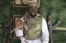 FILE: This file image made available from Wednesday, Jan. 10, 2012, taken from video posted by Boko Haram sympathizers shows the leader of the radical Islamist sect Imam Abubakar Shekau. Shaking a finger while cradling an assault rifle, the bearded leader of Nigeria's extremist Islamic sect Abubakar Shekau threaten in a video on Saturday July 13, 2013 to burn down more schools and kill teachers. But he denies his fighters are killing children. (AP Photo, FIle ) THE ASSOCIATED PRESS CANNOT INDEPENDENTLY VERIFY THE CONTENT, DATE, LOCATION OR AUTHENTICITY OF THIS MATERIAL
