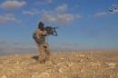 A still image taken from a video released by Islamic State-affiliated Amaq news agency, on December 11, 2016, purports to show an Islamic State fighter shooting near what is said to be Palmyra