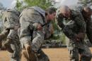 Handout photo shows Then U.S. Army First Lieutenan Kirsten Griest and fellow soldiers participating in combatives training during the Ranger Course on Fort Benning, Georgia