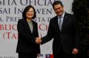 Taiwan's President Tsai Ing-wen shakes hands with her Honduran counterpart Juan Orlando Hernandez during a visit to the Presidential House in Tegucigalpa