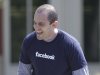 Facebook employee David Fisch laughs outside of Facebook headquarters in Menlo Park, Calif., Friday, May 18, 2012. Facebook's stock is trading up Friday, as investors seek to put a dollar value on the company that turned online social networking into a global cultural phenomenon.  (AP Photo/Paul Sakuma)
