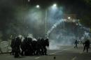 Kosovo police fire tear gas at supporters of opposition MP Albin Kurti during clashes in central Pristina on October 12, 2015