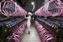 An employee works inside a silk factory in Neijiang