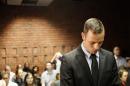 Pistorius stands in the dock during a break in court proceedings at the Pretoria Magistrates court